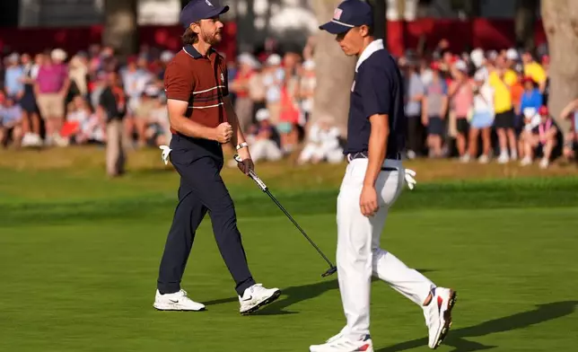 Europe's Tommy Fleetwood celebrates after a putt on the seventh hole at Bethpage Black golf course during the Ryder Cup golf tournament, Saturday, Sept. 27, 2025, in Farmingdale, N.Y. (AP Photo/Lindsey Wasson)