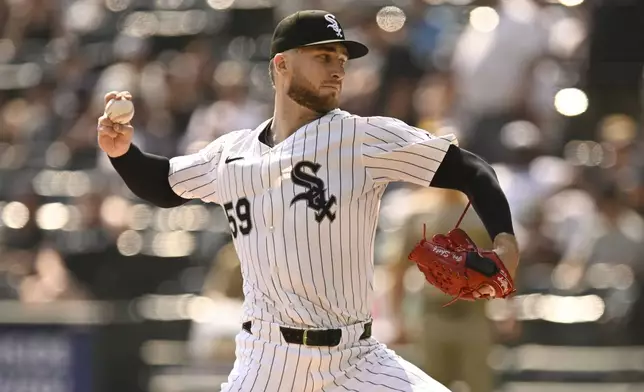 Chicago White Sox starter Sean Burke delivers a pitch during the first inning of a baseball game against the San Diego Padres, Sunday, Sept. 21, 2025, in Chicago. (AP Photo/Paul Beaty)
