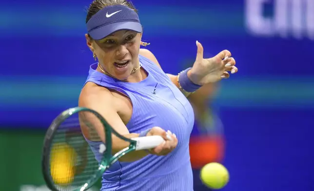 Amanda Anisimova, of the United States, returns a shot to Naomi Osaka, of Japan, during the women's singles semifinals of the U.S. Open tennis championships, Thursday, Sept. 4, 2025, in New York. (AP Photo/Yuki Iwamura)