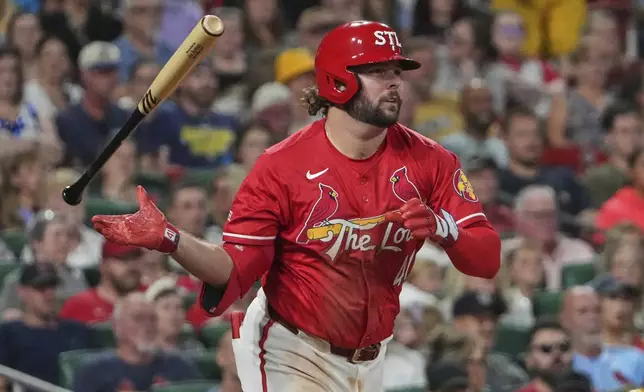 St. Louis Cardinals' Alec Burleson drops his bat after hitting a single during the fifth inning of a baseball game against the Milwaukee Brewers Friday, Sept. 19, 2025, in St. Louis. (AP Photo/Jeff Roberson)