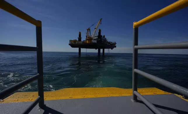 The bow of the Gaspee, a crew transport vessel, is seen as it approaches the Liftboat Robert platform and Expedition 501 in the North Atlantic, Saturday, July 19, 2025. (AP Photo/Carolyn Kaster)