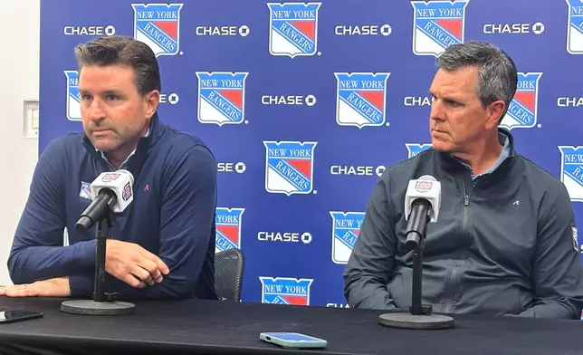 New York Rangers general manager Chris Drury, left, and new head coach Mike Sullivan speak with reporters during an NHL hockey news conference, Wednesday, Sept. 17, 2025, in Tarrytown, N.Y. (AP Photo/Stephen Whyno)