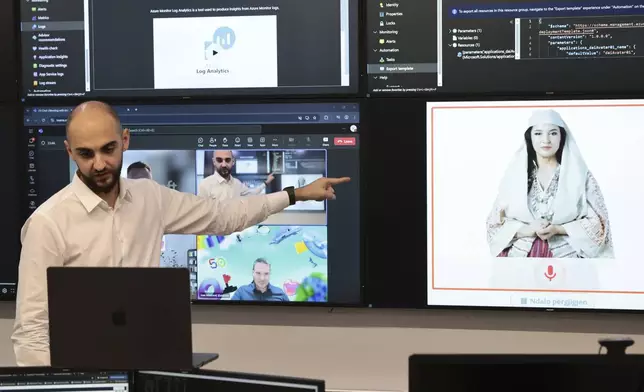 Enio Kaso, head of the Department of Artificial Intelligence and Cryptocurrency Licensing shows the AI "minister" Diella, whose name means "Sun" in Albanian, during a conference call in Tirana, Albania, Friday, Sept. 12, 2025. (AP Photo/Vlasov Sulaj)