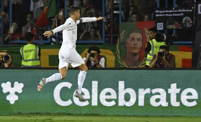 Portugal's Cristiano Ronaldo celebrates after scoring his side's second goal during a World Cup 2026 group F qualifying soccer match between Armenia and Portugal at the Vazgen Sargsyan stadium in Yerevan, Armenia, Saturday, Sept. 6, 2025. (AP Photo/Hakob Berberyan)