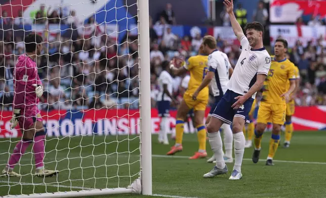 England's Declan Rice celebrates after his team scored their side's first goal during the World Cup Group K qualifying match between England and Andorra at Villa Park stadium in Birmingham, Saturday, Sept. 6, 2025 . (AP Photo/Dave Shopland)