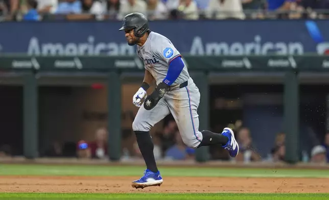 Miami Marlins' Otto Lopez steals second base during the second inning of a baseball game against the Texas Rangers on Sunday, Sept. 21, 2025, in Arlington, Texas. (AP Photo/Ronaldo Bolaños)