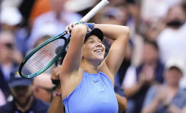 Amanda Anisimova, of the United States, reacts after defeating Iga Swiatek, of Poland, in the quarterfinal round of the U.S. Open tennis championships, Wednesday, Sept. 3, 2025, in New York. (AP Photo/Yuki Iwamura)