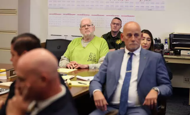 Orange County Superior Court Judge Jeffrey Ferguson reacts as he listens to victim impact statements while appearing for sentencing after his second-degree murder conviction for shooting his wife, at the Central Justice Center in Santa Ana, Calif., Wednesday, Sept. 17, 2025. (Allen J. Schaben/Los Angeles Times via AP, Pool)