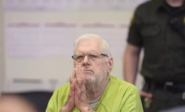 Orange County Superior Court Judge Jeffrey Ferguson reacts as he listens to victim impact statements while appearing for sentencing after his second-degree murder conviction for shooting his wife following an hours-long argument at the Central Justice Center in Santa Ana, Calif., Wednesday, Sept. 17, 2025. (Allen J. Schaben/Los Angeles Times via AP, Pool)