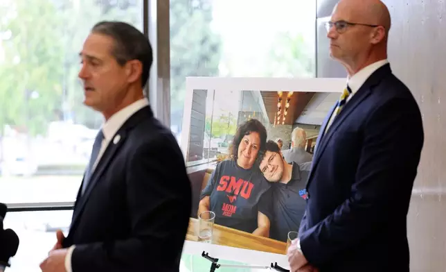 A photo of Sheryl Ferguson, the wife and son Phillip Ferguson of Orange County Superior Judge Jeffrey Ferguson is displayed as Orange County District Attorney Todd Spitzer, left, and Senior Deputy District Attorneys Seton Hunt speak to the media after Orange County Superior Court Judge Jeffrey Ferguson was sentenced to 35 years to life in prison after his second-degree murder conviction for shooting his wife, at the Central Justice Center in Santa Ana, Calif., Wednesday, Sept. 17, 2025. (Allen J. Schaben/Los Angeles Times via AP, Pool)