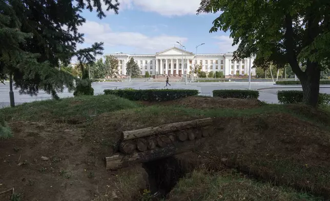 A man walks past a central square in Kramatorsk, Ukraine, Friday, Sept. 5, 2025. (AP Photo/Evgeniy Maloletka)