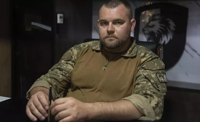 Pavlo Yurchuk, commander of the 63rd Mechanized Brigade, poses for a portrait in his cabinet in Donetsk region, Ukraine, Thursday, Sept.11, 2025. (AP Photo/Alex Babenko)