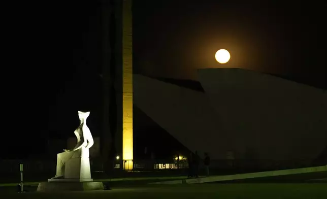 The moon rises over the Supreme Court, a day before former President Jair Bolsonaro's trial, in Brasilia, Brazil, Monday, Sept. 8, 2025. (AP Photo/Eraldo Peres)