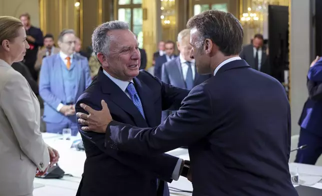 White House Special Envoy Steve Witkoff, left, shakes hand with France's President Emmanuel Macron during a summit on Ukraine at the Elysee Palace, in Paris, France, Thursday, Sept. 4, 2025. (Ludovic Marin/Pool Photo via AP)