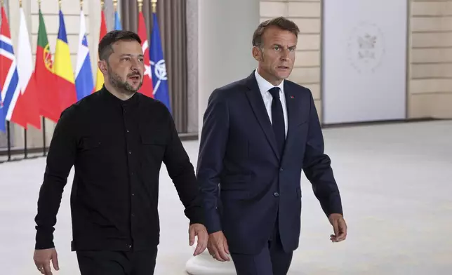 Ukraine's President Volodymyr Zelenskyy, left, and French President Emmanuel Macron, arrive to attend a summit on Ukraine at the Elysee Palace, in Paris, France, Thursday, Sept. 4, 2025. (Ludovic Marin/Pool Photo via AP)