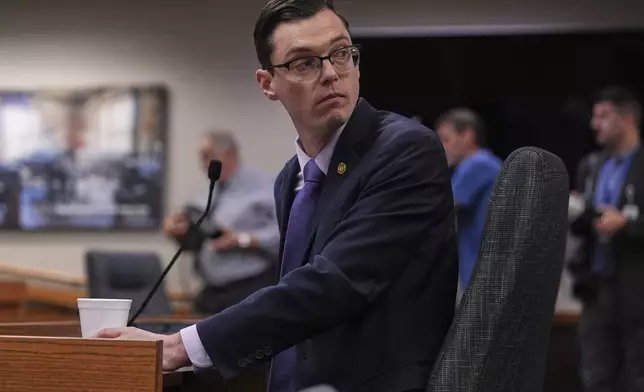 Missouri state Rep. Dirk Deaton, R-Seneca, sponsor of a bill that would redraw the state's U.S. House districts, looks into the crowd behind him as he testifies during a committee hearing on the subject Thursday, Sept. 4, 2025, in Jefferson City, Mo. (AP Photo/Jeff Roberson)