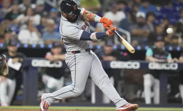 Detroit Tigers' Gleyber Torres hits a sacrifice fly to score Zach McKinstry during the fifth inning of a baseball game against the Miami Marlins, Saturday, Sept. 13, 2025, in Miami. (AP Photo/Lynne Sladky)