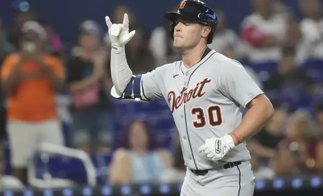 Detroit Tigers' Kerry Carpenter (30) runs the bases after hitting a two run home run during the third inning of a baseball game against the Miami Marlins, Saturday, Sept. 13, 2025, in Miami. (AP Photo/Lynne Sladky)