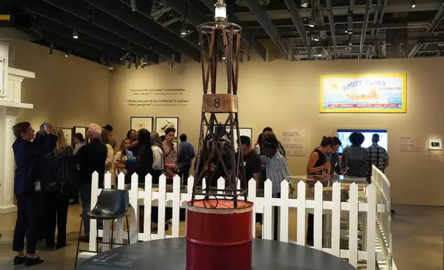 A prop buoy from the 1975 film "Jaws" is displayed for visitors at the "Jaws: The Exhibition" press preview on Wednesday, Sept. 10, 2025, at the Academy Museum of Motion Pictures in Los Angeles. (AP Photo/Chris Pizzello)