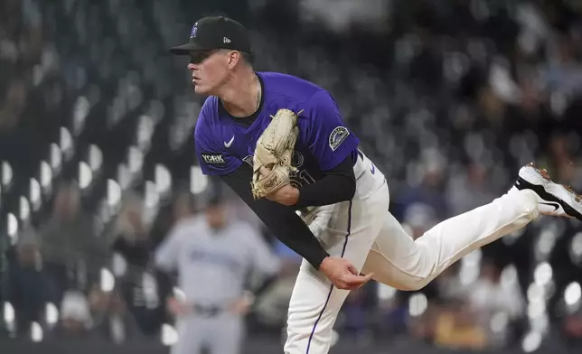 Colorado Rockies starting pitcher McCade Brown works against the Miami Marlins in the first inning of a baseball game Wednesday, Sept. 17, 2025, in Denver. (AP Photo/David Zalubowski)