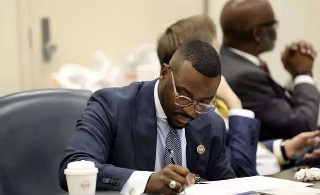FILE - State Rep. Hamilton Grant, D-Columbia, takes notes during a meeting of the Legislative Black Caucus, Tuesday, Jan. 14, 2025, in Columbia, S.C. (AP Photo/Jeffrey Collins, File)