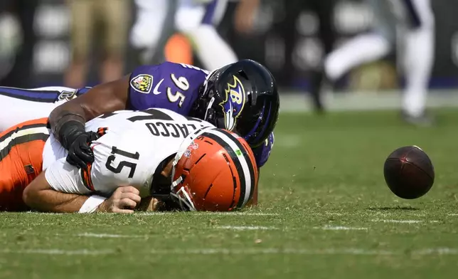 Baltimore Ravens linebacker Tavius Robinson sacks Cleveland Browns quarterback Joe Flacco forcing a fumble during the second half of an NFL football game, Sunday, Sept. 14, 2025, in Baltimore. (AP Photo/Nick Wass)