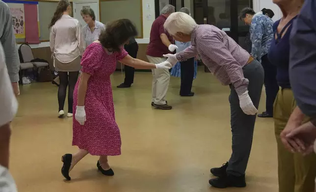 Members of the Hampshire Regency Dancers practice dance in Winchester, England, Sept. 10, 2025, ahead of the 10 days Jane Austen Festival starting on Friday. (AP Photo/Joanna Chan)