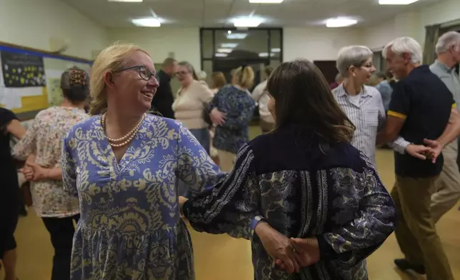 Members of the Hampshire Regency Dancers practice dance in Winchester, England, Sept. 10, 2025, ahead of the 10 days Jane Austen Festival starting on Friday. (AP Photo/Joanna Chan)