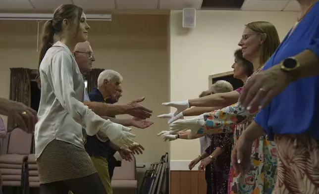 Members of the Hampshire Regency Dancers practice dance in Winchester, England, Sept. 10, 2025, ahead of the 10 days Jane Austen Festival starting on Friday. (AP Photo/Joanna Chan)
