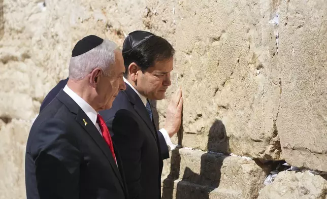 Israeli Prime Minister Benjamin Netanyahu, left, and U.S. Secretary of State Marco Rubio visit the Western Wall, the holiest site where Jews can pray, in the Old City of Jerusalem Sunday, Sept. 14, 2025. (AP Photo/Ariel Schalit)