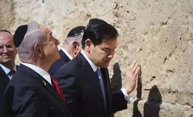 Israeli Prime Minister Benjamin Netanyahu, left, and U.S. Secretary of State Marco Rubio visit the Western Wall, the holiest site where Jews can pray, in the Old City of Jerusalem Sunday, Sept. 14, 2025. (AP Photo/Ariel Schalit)