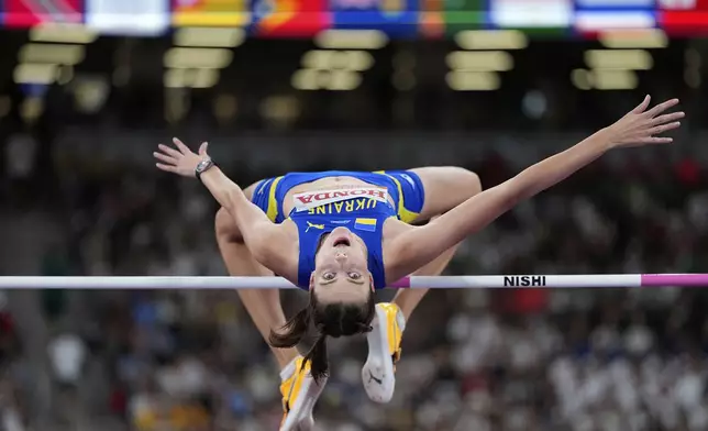 Ukraine's Yaroslava Mahuchikh makes an attempt in the women's high jump qualification at the World Athletics Championships in Tokyo, Thursday, Sept. 18, 2025. (AP Photo/Matthias Schrader)