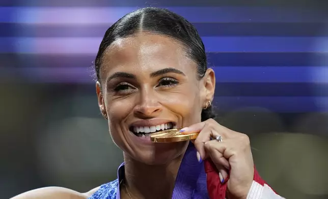 United States' Sydney McLaughlin-Levrone reacts after winning the gold medal in the women's 400 meters final at the World Athletics Championships in Tokyo, Thursday, Sept. 18, 2025. (AP Photo/Petr David Josek)