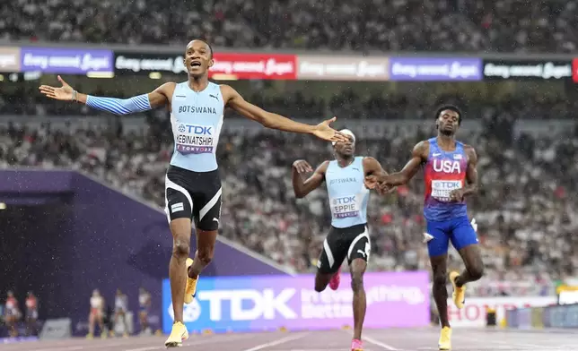 Botswana's Busang Collen Kebinatshipi celebrates taking the gold medal in the men's 400 meters final at the World Athletics Championships in Tokyo, Thursday, Sept. 18, 2025. (AP Photo/Petr David Josek)