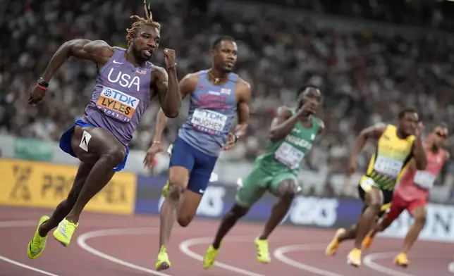 United States' Noah Lyles competes in the men's 200 meters heats at the World Athletics Championships in Tokyo, Thursday, Sept. 18, 2025. (AP Photo/Louise Delmotte)