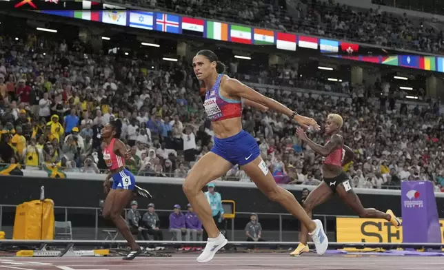 United States' Sydney McLaughlin-Levrone wins the women's 400 meters final at the World Athletics Championships in Tokyo, Thursday, Sept. 18, 2025. (AP Photo/David J. Phillip)