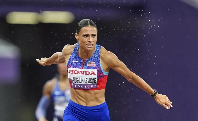 United States' Sydney McLaughlin-Levrone wins the gold medal in the women's 400 meters final at the World Athletics Championships in Tokyo, Thursday, Sept. 18, 2025. (AP Photo/Petr David Josek)
