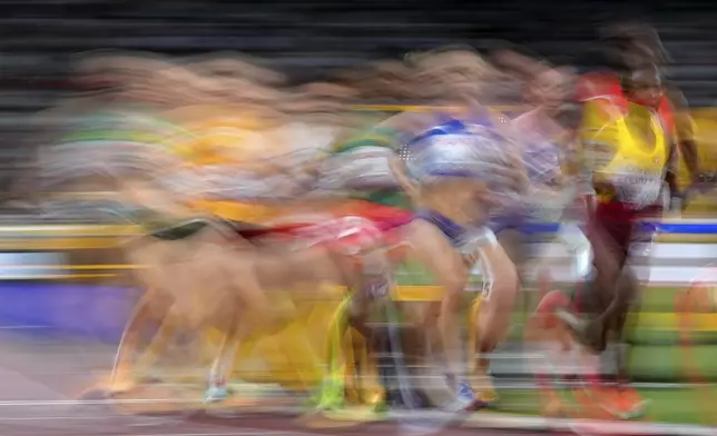 Athletes race in a women's 5,000 meters heat at the World Athletics Championships in Tokyo, Thursday, Sept. 18, 2025. (AP Photo/Petr David Josek)