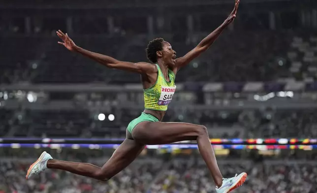 Senegal's Saly Sarr makes an attempt in the women's triple jump final at the World Athletics Championships in Tokyo, Thursday, Sept. 18, 2025. (AP Photo/Matthias Schrader)