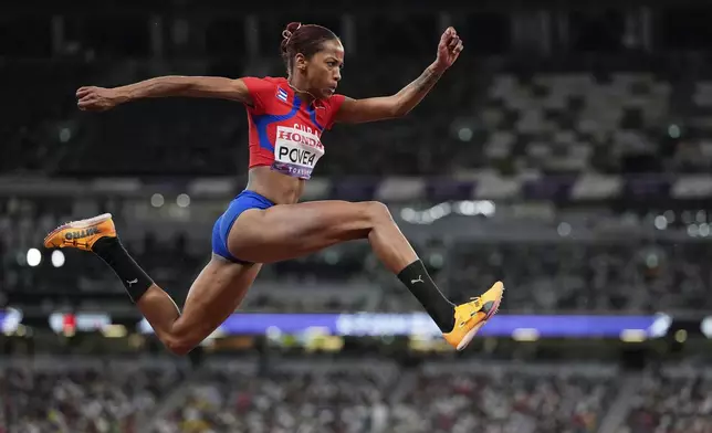 Cuba's Liadagmis Povea makes an attempt in the women's triple jump final at the World Athletics Championships in Tokyo, Thursday, Sept. 18, 2025. (AP Photo/Matthias Schrader)