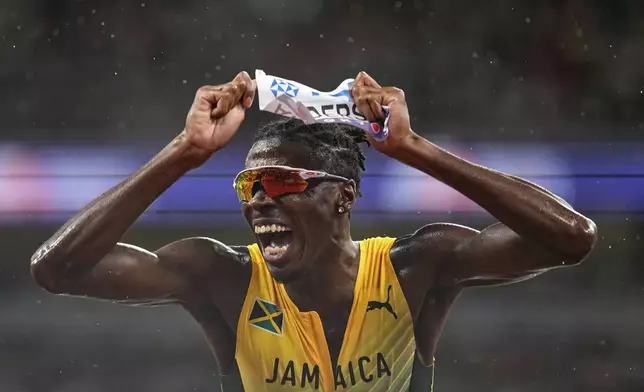 Jamaica's Navasky Anderson reacts after finishing a men's 800 meters semifinal at the World Athletics Championships in Tokyo, Thursday, Sept. 18, 2025. (AP Photo/Petr David Josek)