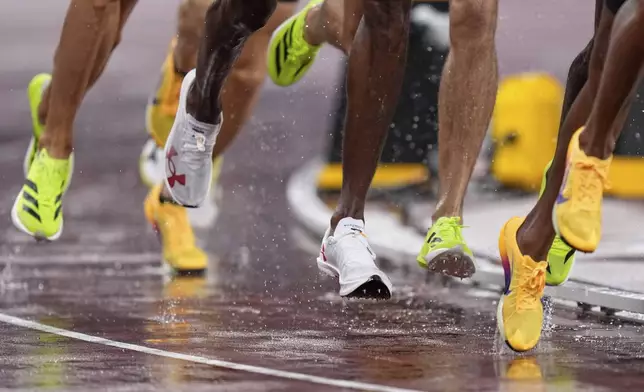 Athletes compete in men's 800 meters semifinal at the World Athletics Championships in Tokyo, Thursday, Sept. 18, 2025. (AP Photo/Eugene Hoshiko)