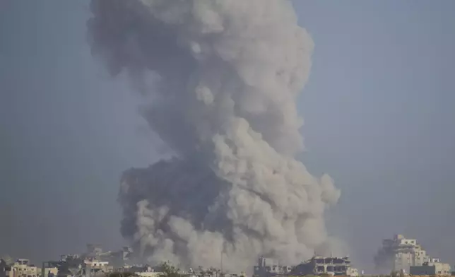 Smoke rises following an explosion in the Gaza Strip, as seen from southern Israel, Sunday, Sept. 21, 2025. (AP Photo/Ohad Zwigenberg)