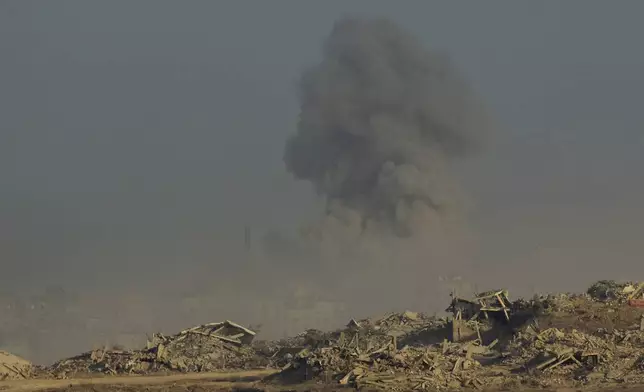 Smoke rises following an explosion in the Gaza Strip, as seen from southern Israel, Sunday, Sept. 21, 2025. (AP Photo/Ohad Zwigenberg)
