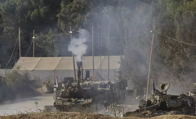 An Israeli mobile artillery unit fires a shell from southern Israel towards the Gaza Strip, in a position near the Israel-Gaza border on, Sunday, Sept. 21, 2025. (AP Photo/Ohad Zwigenberg)