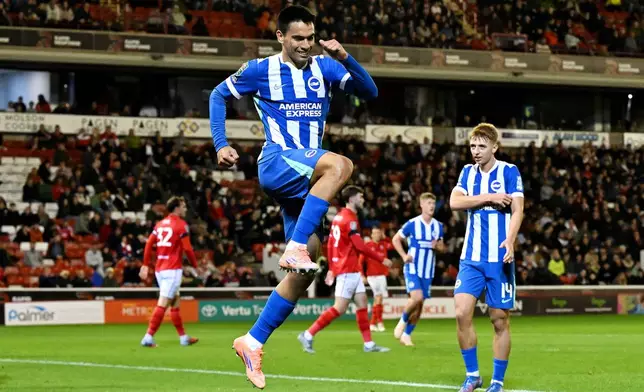 Brighton and Hove Albion's Diego Gomez celebrates scoring during the English League Cup third round soccer match between Barnsley and Brighton &amp; Hove Albion at Oakwell Stadium, Barnsley, England, Tuesday Sept. 23, 2025. (Cody Froggatt/PA via AP)
