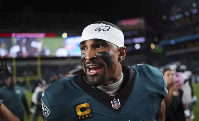 Philadelphia Eagles' Jalen Hurts celebrates the team's win in an NFL football game against the Dallas Cowboys Friday, Sept. 5, 2025, in Philadelphia. (AP Photo/Matt Slocum)