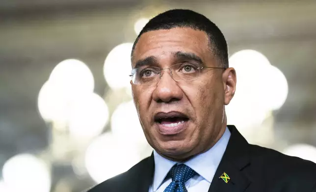 FILE - Prime Minister of Jamaica Andrew Holness speaks following a meeting with Vice President Kamala Harris at the Eisenhower Executive Office Building on the White House complex, in Washington, Wednesday, March 30, 2022. (AP Photo/Manuel Balce Ceneta, File)