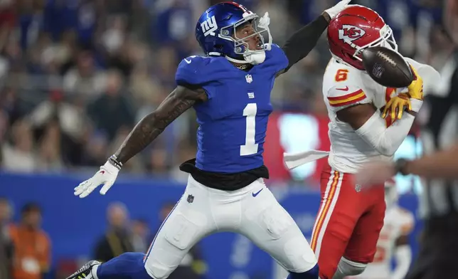 Kansas City Chiefs safety Bryan Cook (6) breaks up a pass intended for New York Giants wide receiver Malik Nabers (1)during the second half of an NFL football game Sunday, Sept. 21, 2025, in East Rutherford, N.J. (AP Photo/Seth Wenig)