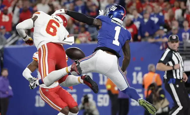 Kansas City Chiefs safety Bryan Cook (6) breaks up a pass intended for New York Giants wide receiver Malik Nabers (1) during the second half of an NFL football game Sunday, Sept. 21, 2025, in East Rutherford, N.J. (AP Photo/Adam Hunger)